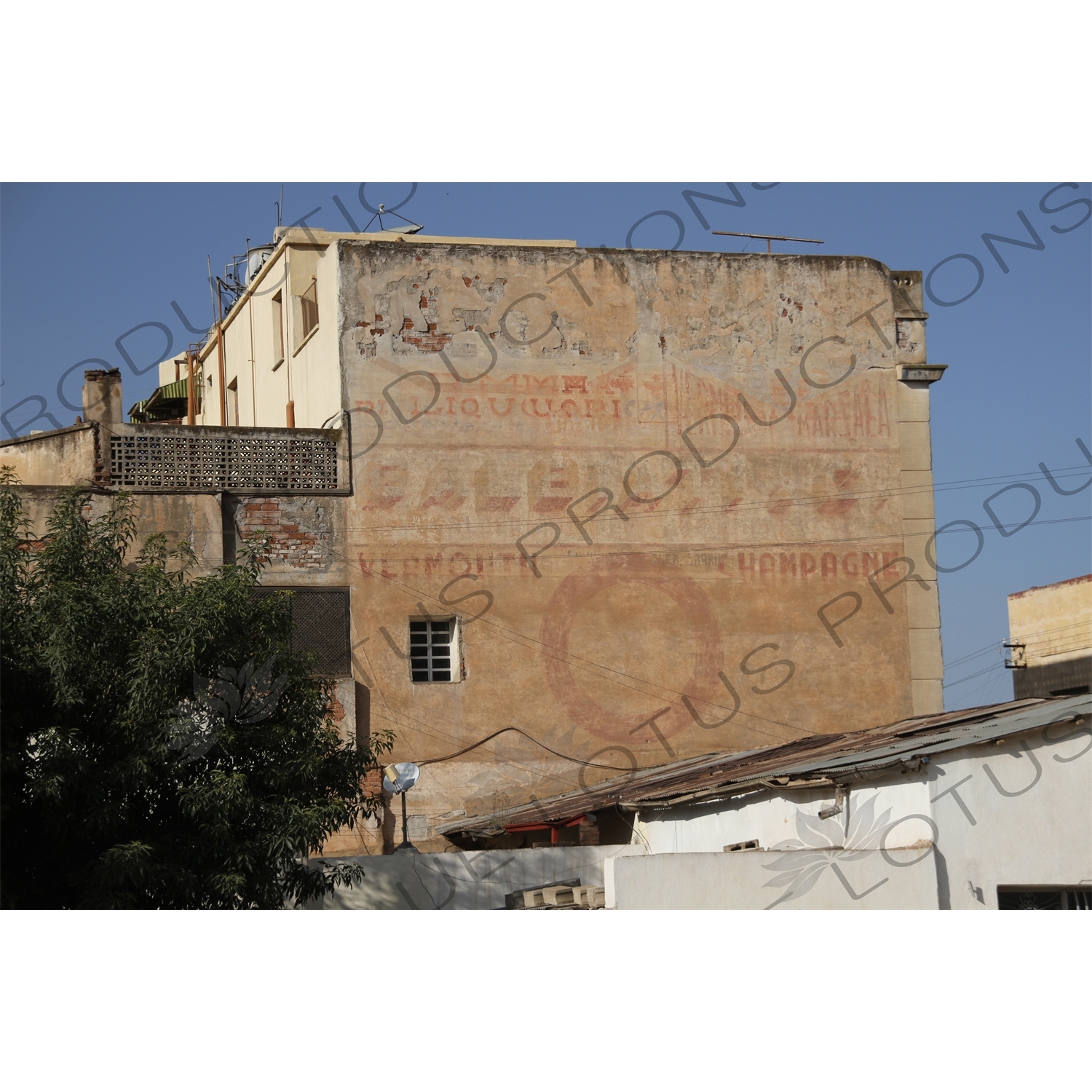 Old Colonial Writing on the side of a Building Advertising Champagne and Vermouth in Asmara