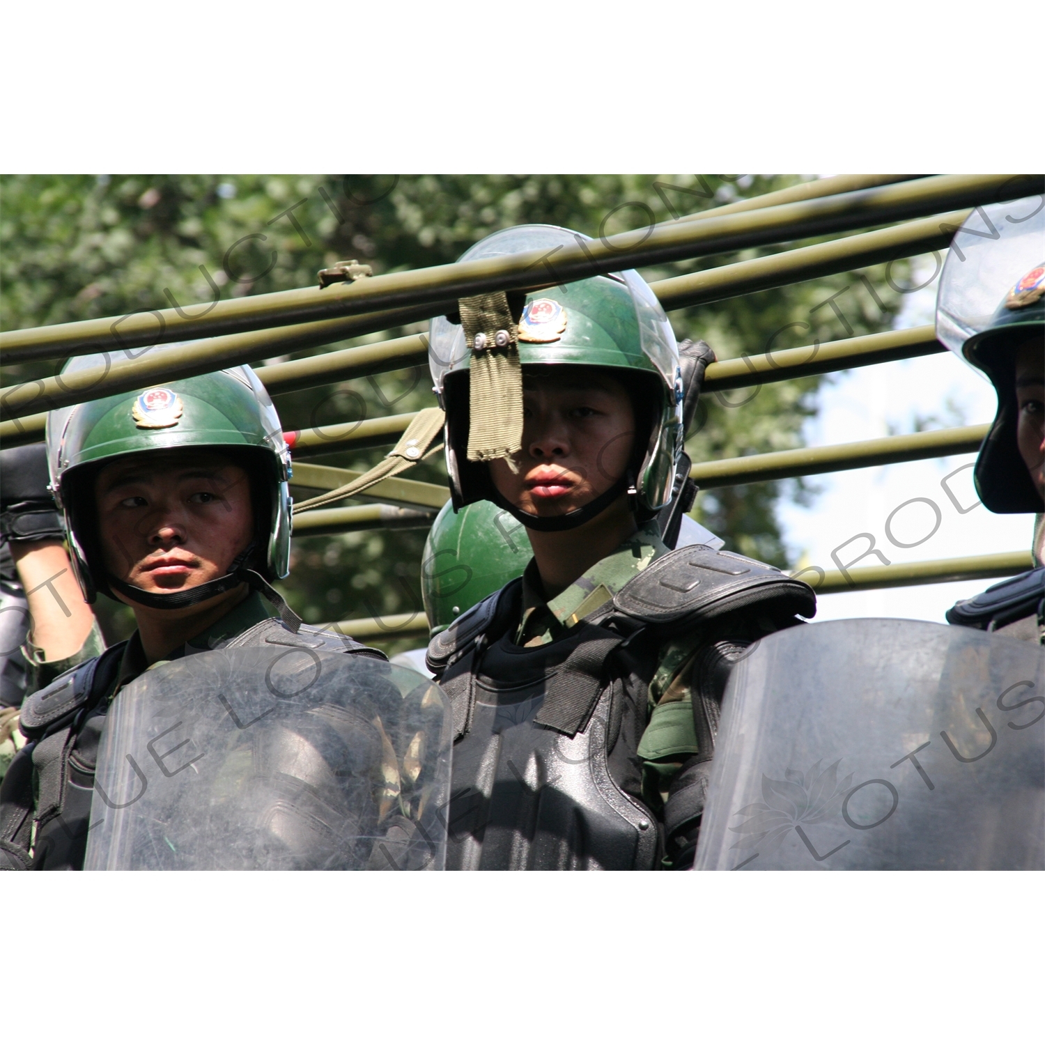 Chinese People's Armed Police Force/PAP (Zhongguo Renmin Wuzhuang Jingcha Budui/Wujing) Officers in a Personnel Transport Vehicle in Urumqi