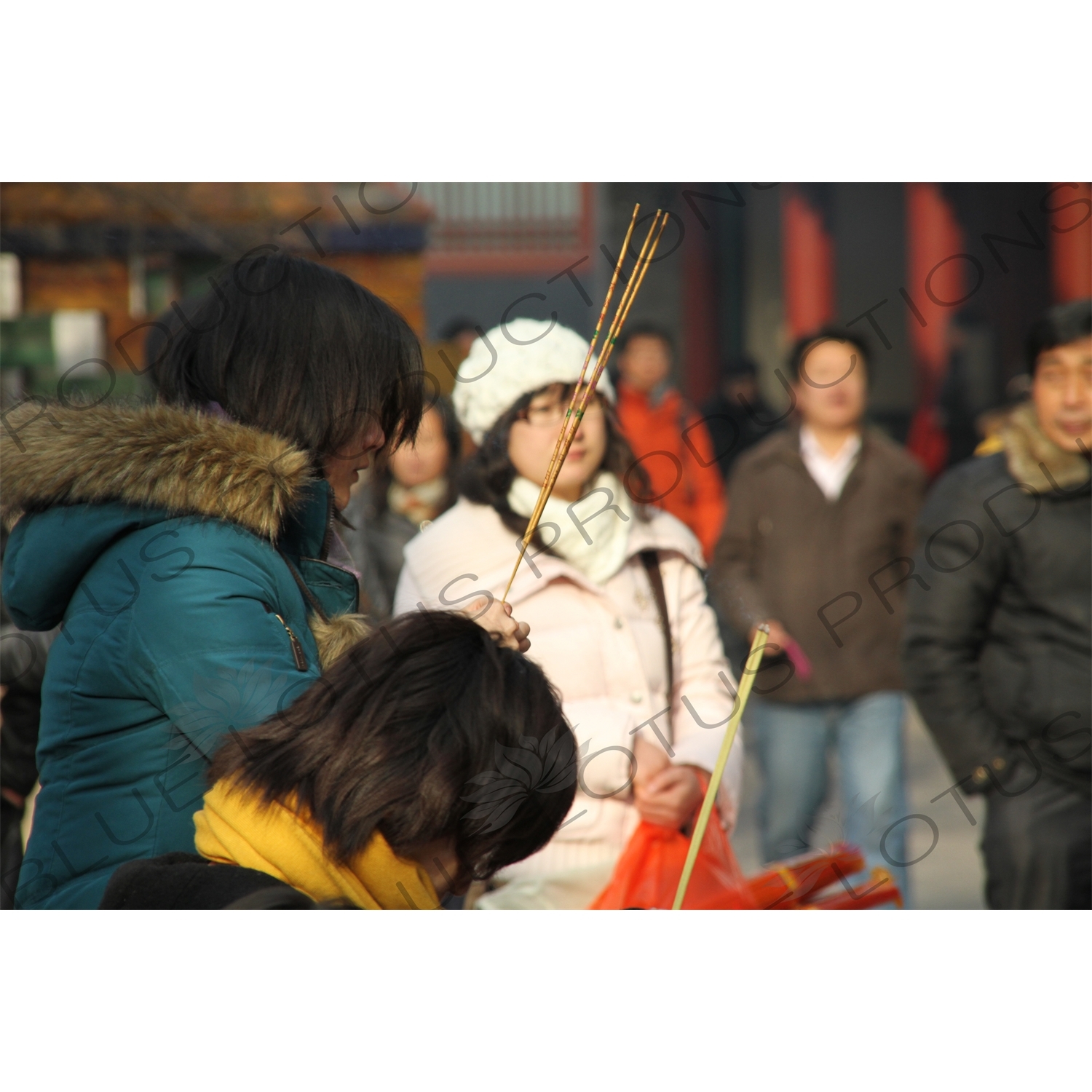 People Burning Incense in the Lama Temple (Yonghegong) in Beijing