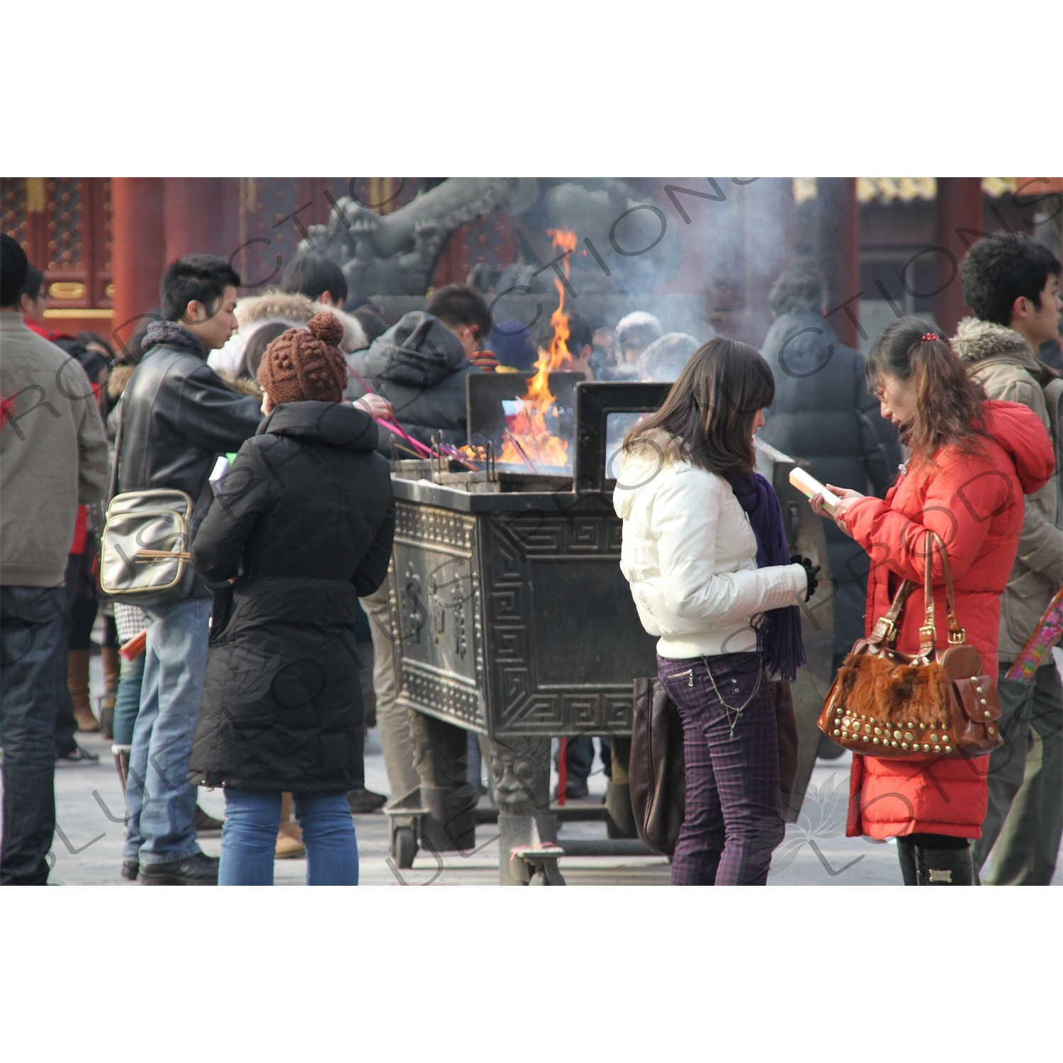 People Burning Incense in the Lama Temple (Yonghegong) in Beijing