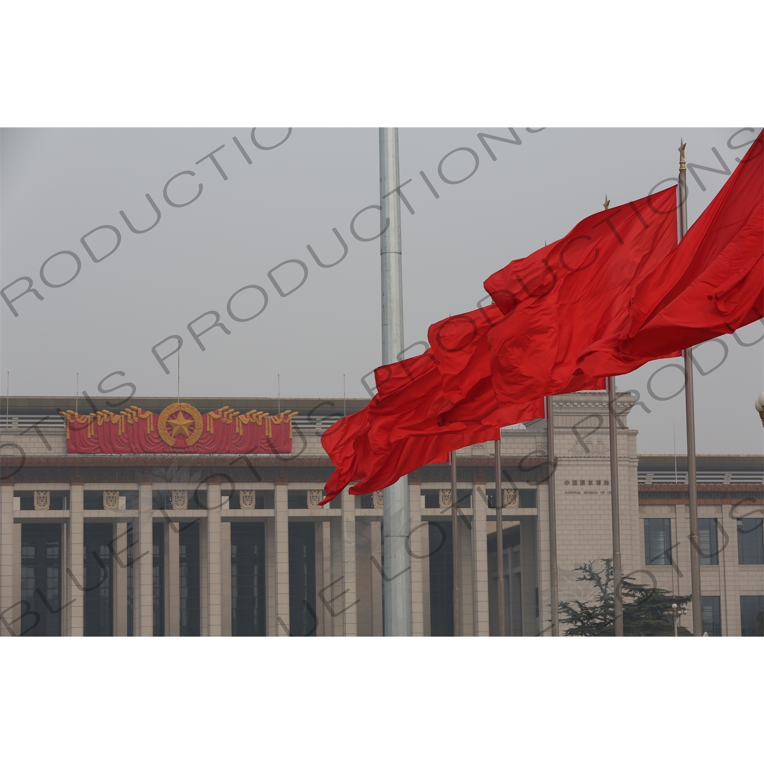 Red Flags and National Museum of China (Zhongguo Guojia Bowuguan) in Tiananmen Square in Beijing