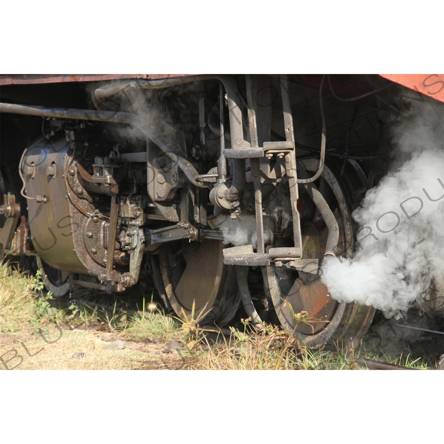 Steam Coming out from behind a Wheel on a Vintage Steam Engine Going from Asmara to Massawa