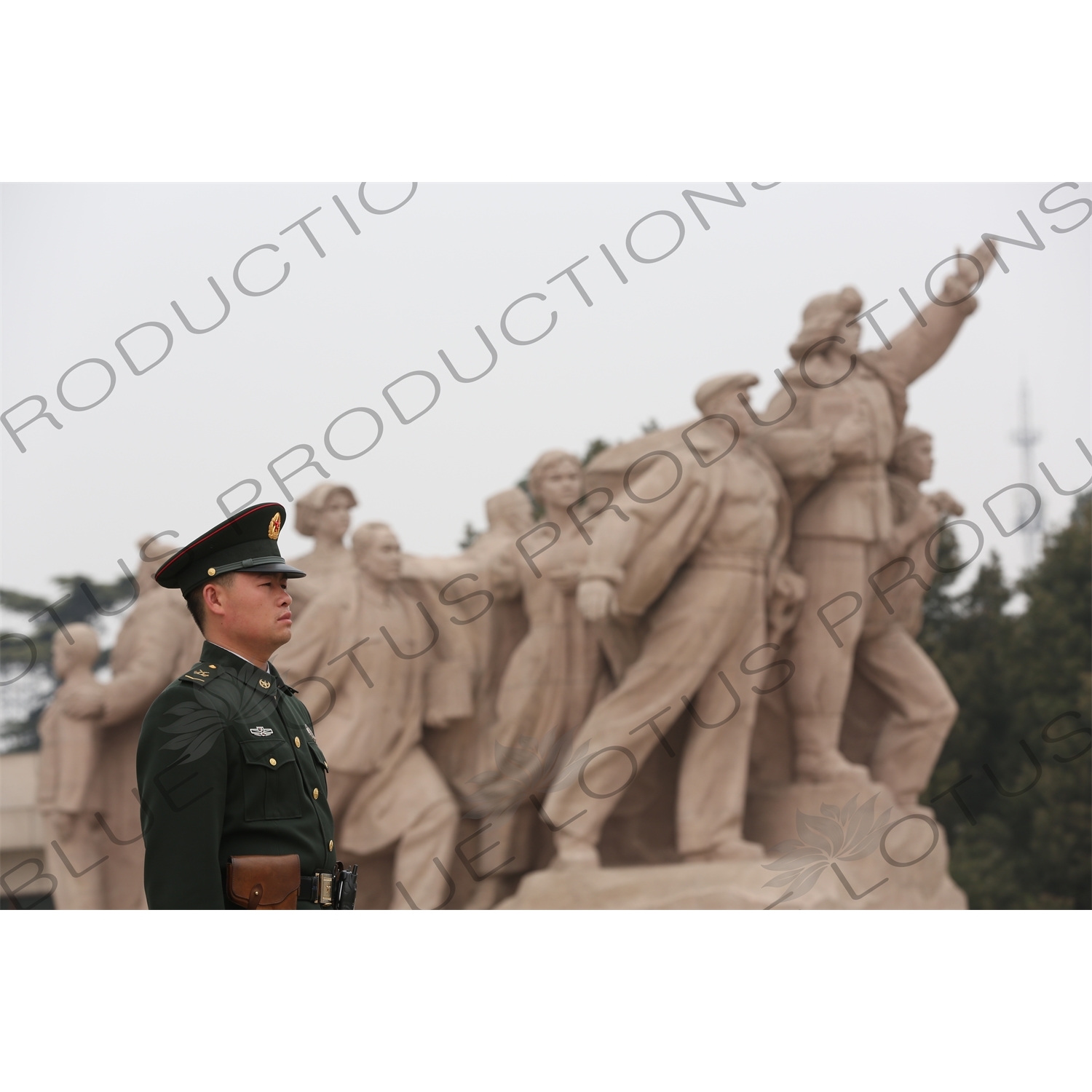 Soldier in front of a 'Heroes of the Revolution' Sculpture outside the Chairman Mao Memorial Hall/Mao's Mausoleum (Mao Zhuxi Jinnian Tang) in Tiananmen Square in Beijing