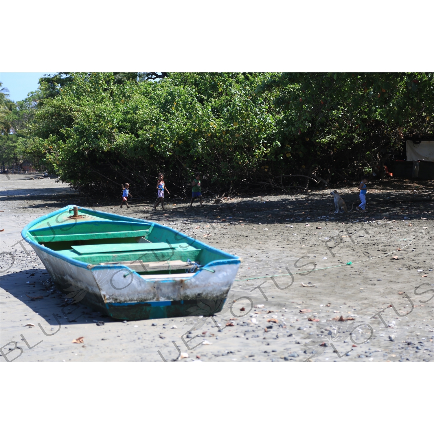 Boat and Children on a Beach in Nosara