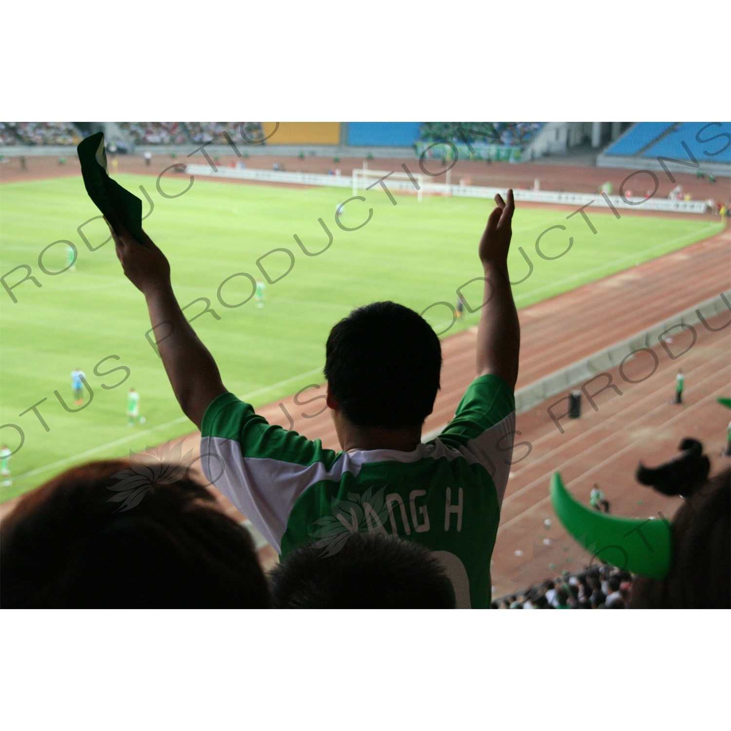 Beijing Guoan Fan During a Chinese Super League Match between Beijing Guoan and Dalian Shide at the Workers' Stadium (Gongren Tiyuchang) in Beijing