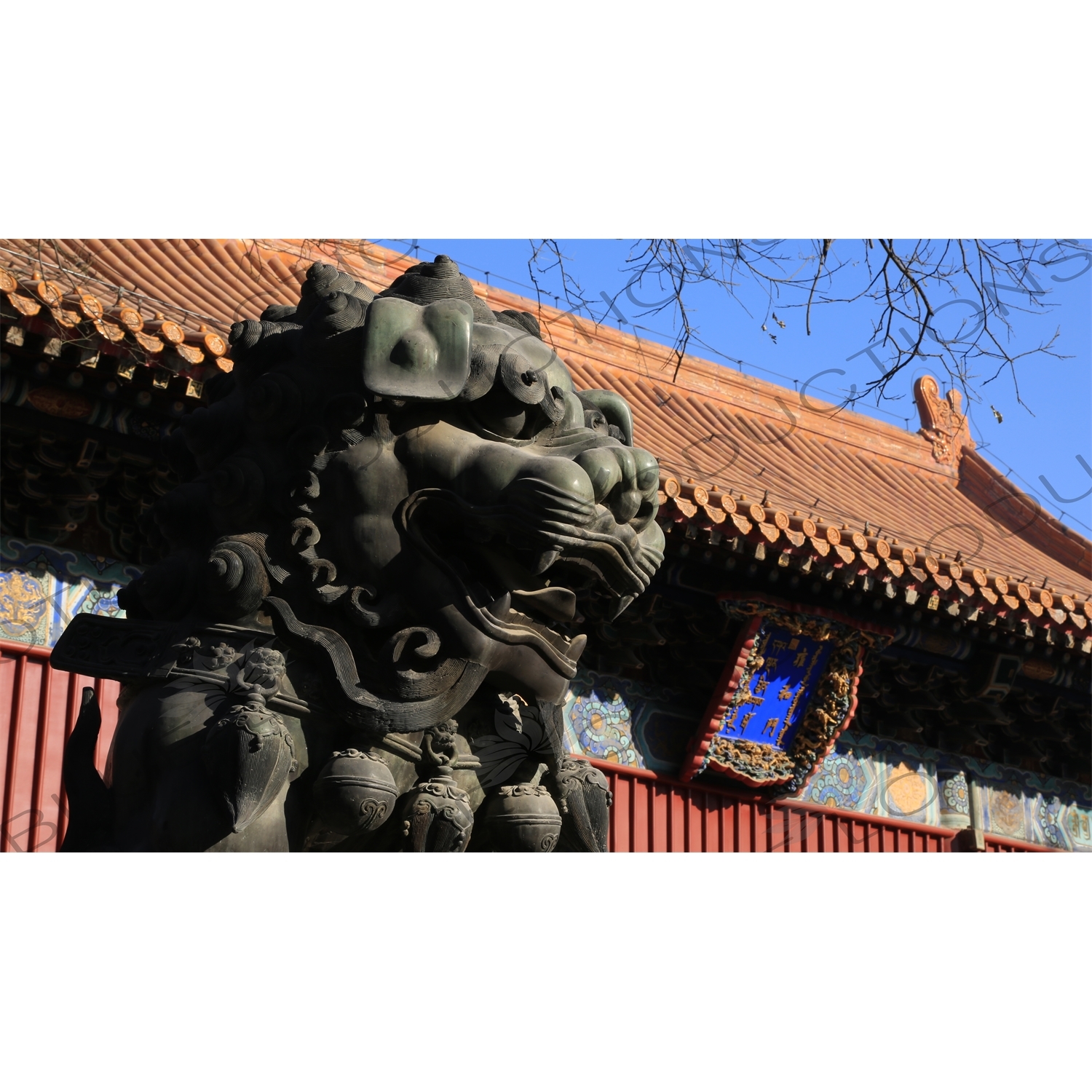 Guardian Lion Statue and Gate of Peace and Harmony (Yonghe Men) in the Lama Temple in Beijing