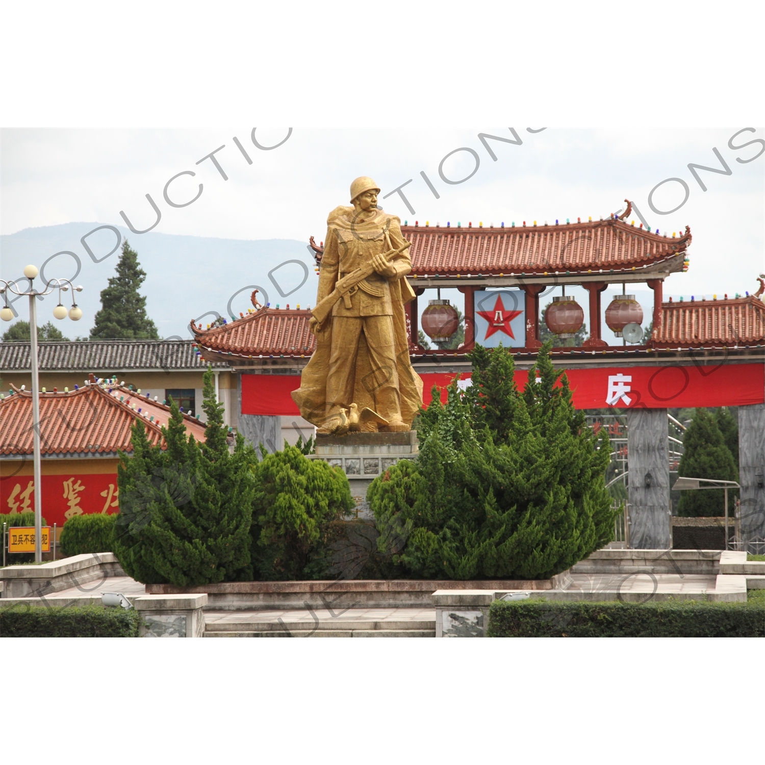 Gold Statue of People's Liberation Army Soldier outside a Military Base in Dali