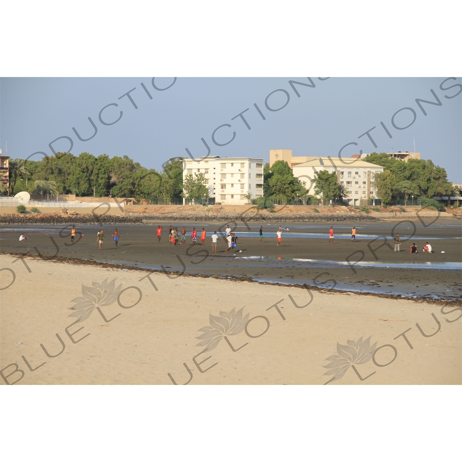 People Playing Football on the Beach in Djbouti City