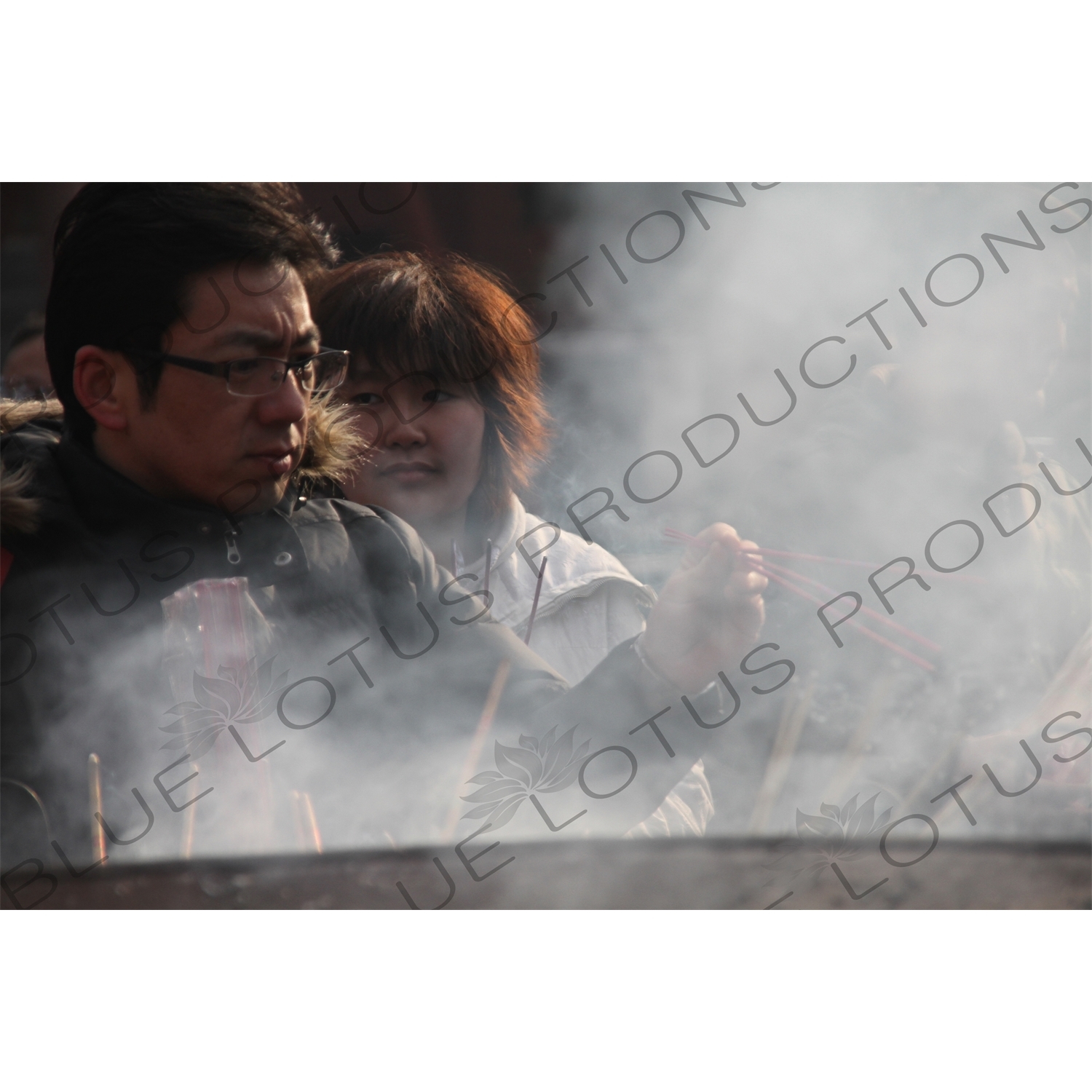 People Burning Incense in the Lama Temple (Yonghegong) in Beijing