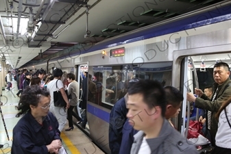 People Boarding a Line 2 Train at Chongwenmen Station in Beijing