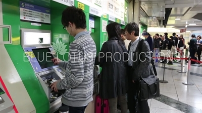 People Buying Tickets in Tokyo Station