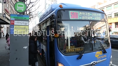 Passengers Boarding a Bus in Seoul