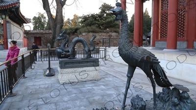 Bronze Statues of a Phoenix and Dragon outside the Hall of Benevolence and Longevity (Renshoudian) in the Summer Palace in Beijing