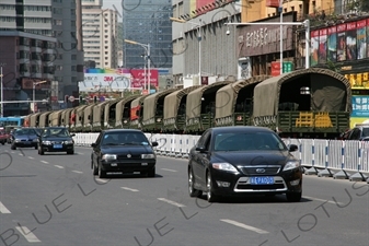 Chinese People's Armed Police Force/PAP (Zhongguo Renmin Wuzhuang Jingcha Budui/Wujing) Personnel Transport Vehicles on a Street in Urumqi