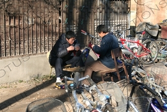 Two Men Playing Cards at the South Gate of the Temple of Heaven (Tiantan) in Beijing