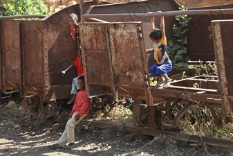 Children Playing on old Railway Cars in a Station along the Asmara to Massawa Railway Line