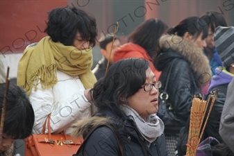 People Burning Incense in the Lama Temple (Yonghegong) in Beijing