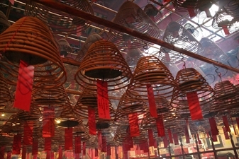 Burning Incense Cones inside Man Mo Temple in Hong Kong