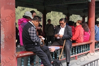 People Playing Cards in the Long Corridor (Chang Lang) in the Temple of Heaven (Tiantan) in Beijing