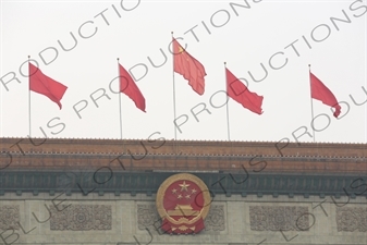 Communist Party of China Insignia and Red Flags on the Great Hall of the People (Renmin Dahuitang) on the West side of Tiananmen Square in Beijing