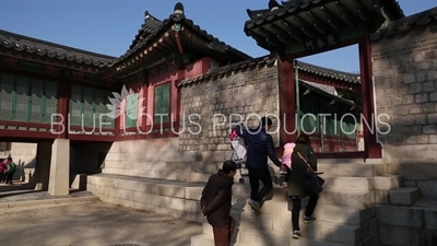 People walking through Yeochun Gate (Yeochunmun) at Changdeok Palace (Changdeokgung) in Seoul