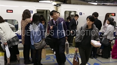 Passengers Getting off a Bullet Train (Shinkansen) at Tokyo Station