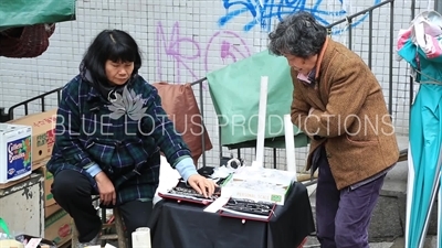 People at a Jewellery Stall on Peel Street in Hong Kong