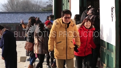 Tourists Taking Photos in the Doorway of Geunjeong Hall (Geunjeongjeon) at Gyeongbok Palace (Gyeongbokgung) in Seoul