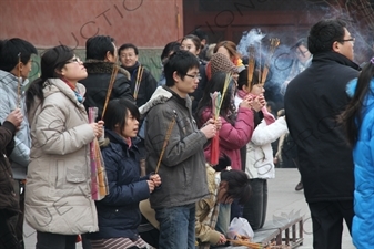 People Burning Incense in the Lama Temple (Yonghegong) in Beijing