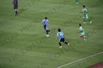 Players in a Chinese Super League Match between Beijing Guoan and Dalian Shide at the Workers' Stadium (Gongren Tiyuchang) in Beijing