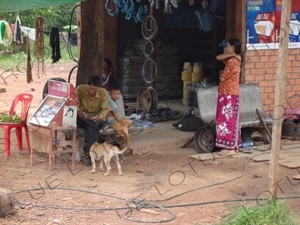 Family Selling Cigarettes by the Roadside in Angkor