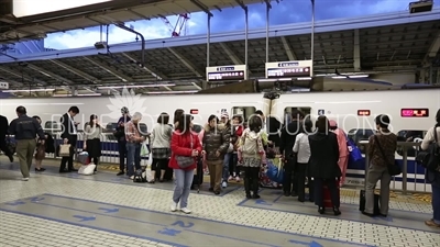 Passengers Getting off a Bullet Train (Shinkansen) at Tokyo Station