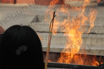 People Burning Incense in the Lama Temple (Yonghegong) in Beijing