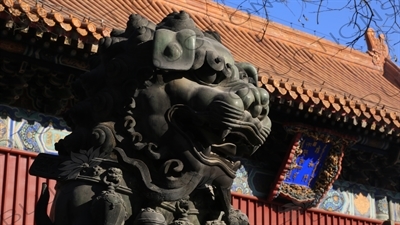 Guardian Lion Statue and the Gate of Peace and Harmony (Yonghe Men) in the Lama Temple in Beijing