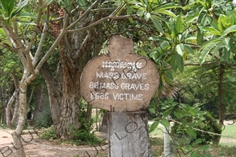 Sign Describing a Mass Grave at the Choeung Ek Killing Fields near Phnom Penh