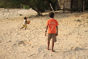 Boys Playing Football on a Beach on Gili Meno