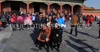 Tourists Taking Photos in front of the Palace of Heavenly Purity (Qianqing Gong) in the Forbidden City in Beijing