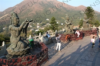 'Offering of the Six Devas' Statues in front of the Big Buddha (Tiantan Da Fo) Statue on Lantau in Hong Kong