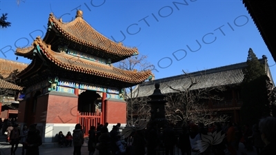 People Throwing Coins at an Incense Burner for Luck in front of the Four Language Stele Pavilion/Imperial Handwriting Pavilion in the Lama Temple in Beijing