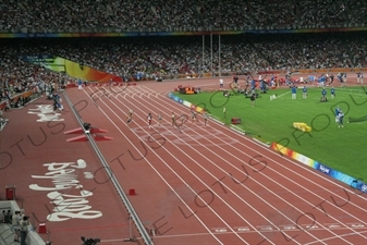 Athletes in a Women's 100 Metres Heat in the Bird's Nest/National Stadium (Niaochao/Guojia Tiyuchang) in the Olympic Park in Beijing