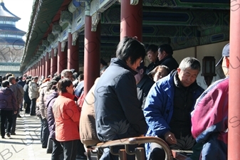 People Playing Games in the Long Corridor (Chang Lang) in the Temple of Heaven (Tiantan) in Beijing