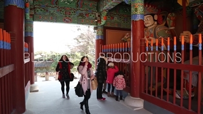 People Praying inside Cheonwang Gate (Cheonwangmun) at Beomeosa Temple in Busan