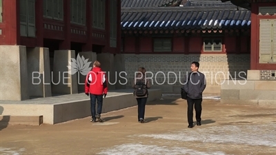People Walking along the side of Gangnyeong Hall (Gangnyeongjeon) at Gyeongbok Palace (Gyeongbokgung) in Seoul