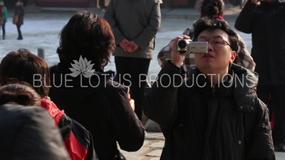 Tourists Taking Photos in front of Geunjeong Hall (Geunjeongjeon) at Gyeongbok Palace (Gyeongbokgung) in Seoul