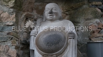 The 'Buddha of Granting a Son' Statue at the Entrance to Haedong Yonggung Temple (Haedong Yonggungsa) in Busan