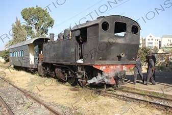 Driver and Engineer Inspecting a Vintage Steam Engine Going from Asmara to Massawa