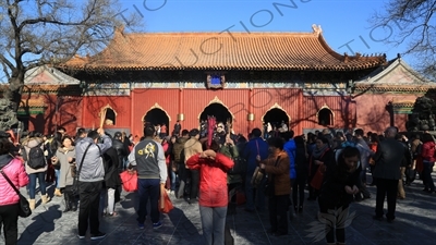 People Burning Incense in front of the Gate of Peace and Harmony (Yonghe Men) in the Lama Temple in Beijing