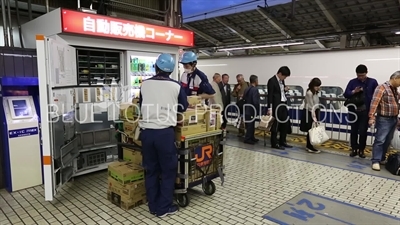 Workers Refilling a Vending Machine in Tokyo station