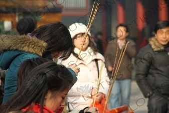 People Burning Incense in the Lama Temple (Yonghegong) in Beijing