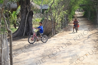 Children Cycling on Gili Meno